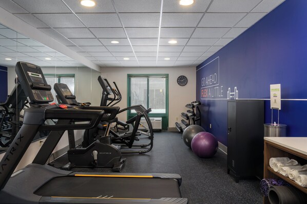 A gym with treadmills, elliptical machines, and exercise balls. - Holiday Inn Express Hotel & Suites Drums by IHG (Drums)