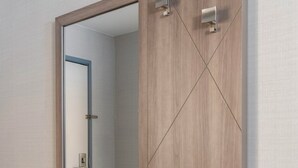 A wall-mounted mirror with a wooden frame and a white shelf below it. - Holiday Inn Express Hotel & Suites Drums by IHG (Drums)