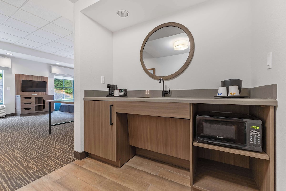 premium bedding, desk, blackout curtains, iron/ironing board