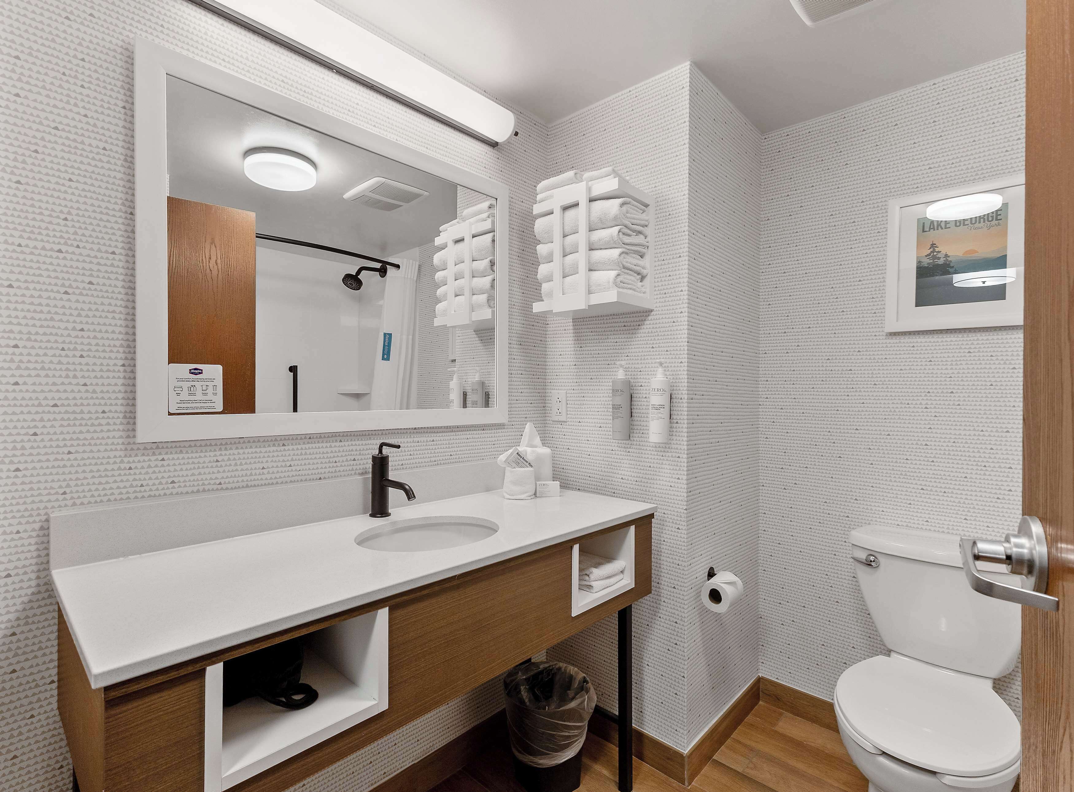 standard two queens | bathroom | combined shower/bathtub, free toiletries, hair dryer, towels