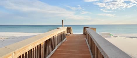 On the beach, white sand, sun-loungers, beach umbrellas