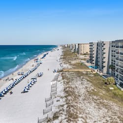 On the beach, white sand, sun-loungers, beach umbrellas