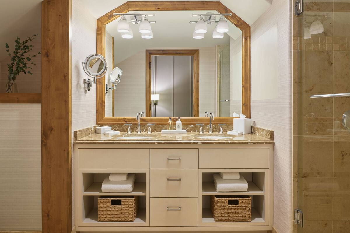 combined shower/bathtub, designer toiletries, hair dryer, bathrobes