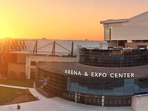 The exterior of the Arena & Expo Center with a modern architectural design, featuring a curved glass facade and a prominent entrance. - Candlewood Suites Fort Wayne by IHG (Fort Wayne)