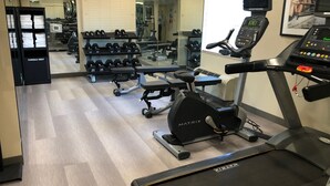 A gym with treadmills, dumbbells, and weight machines. - Candlewood Suites Fort Wayne by IHG (Fort Wayne)