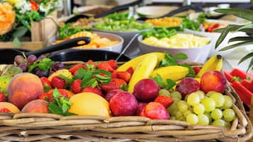 A variety of fruits and vegetables displayed in a basket.