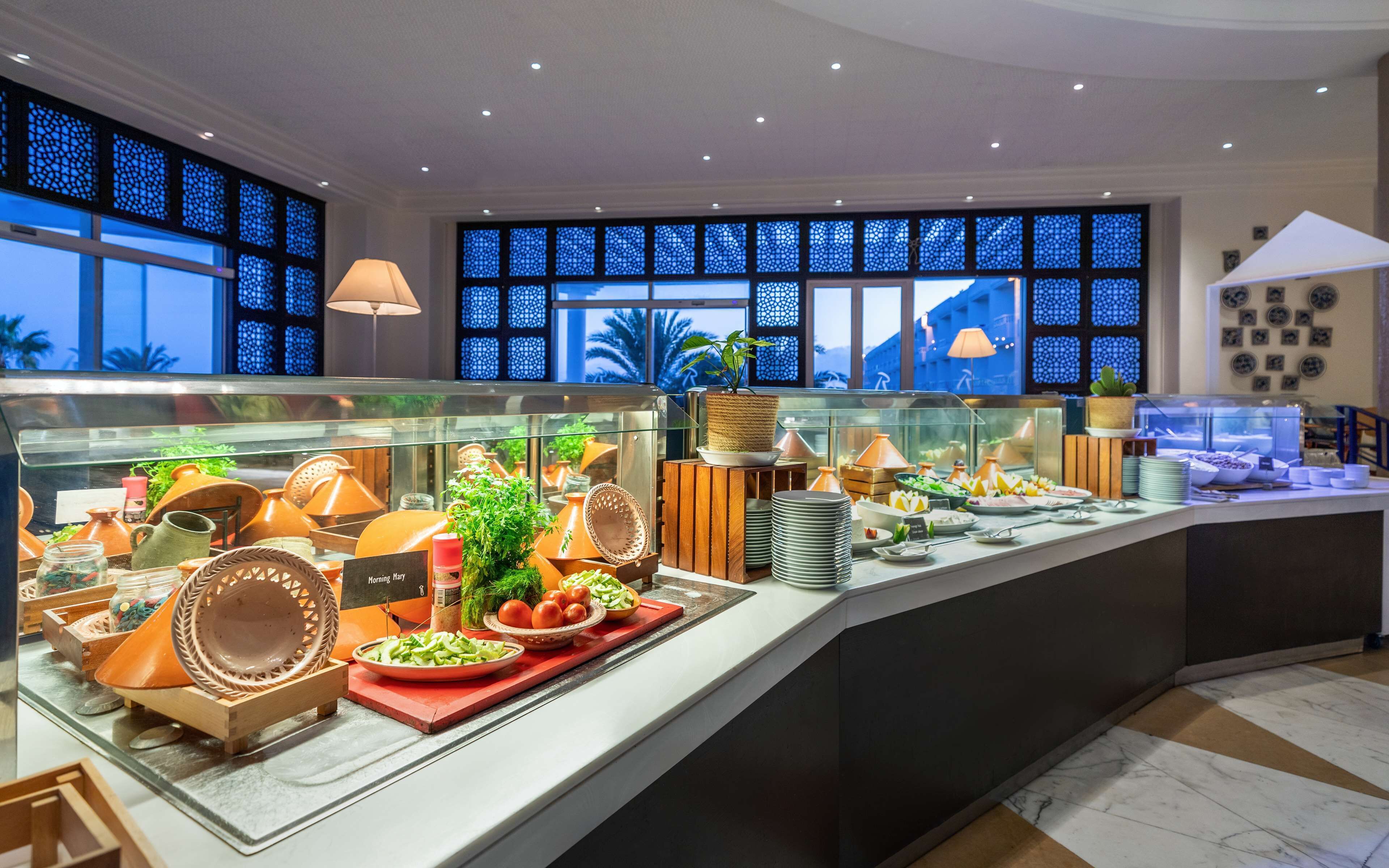 A buffet area with various dishes and a sign that reads "Morning Mary."