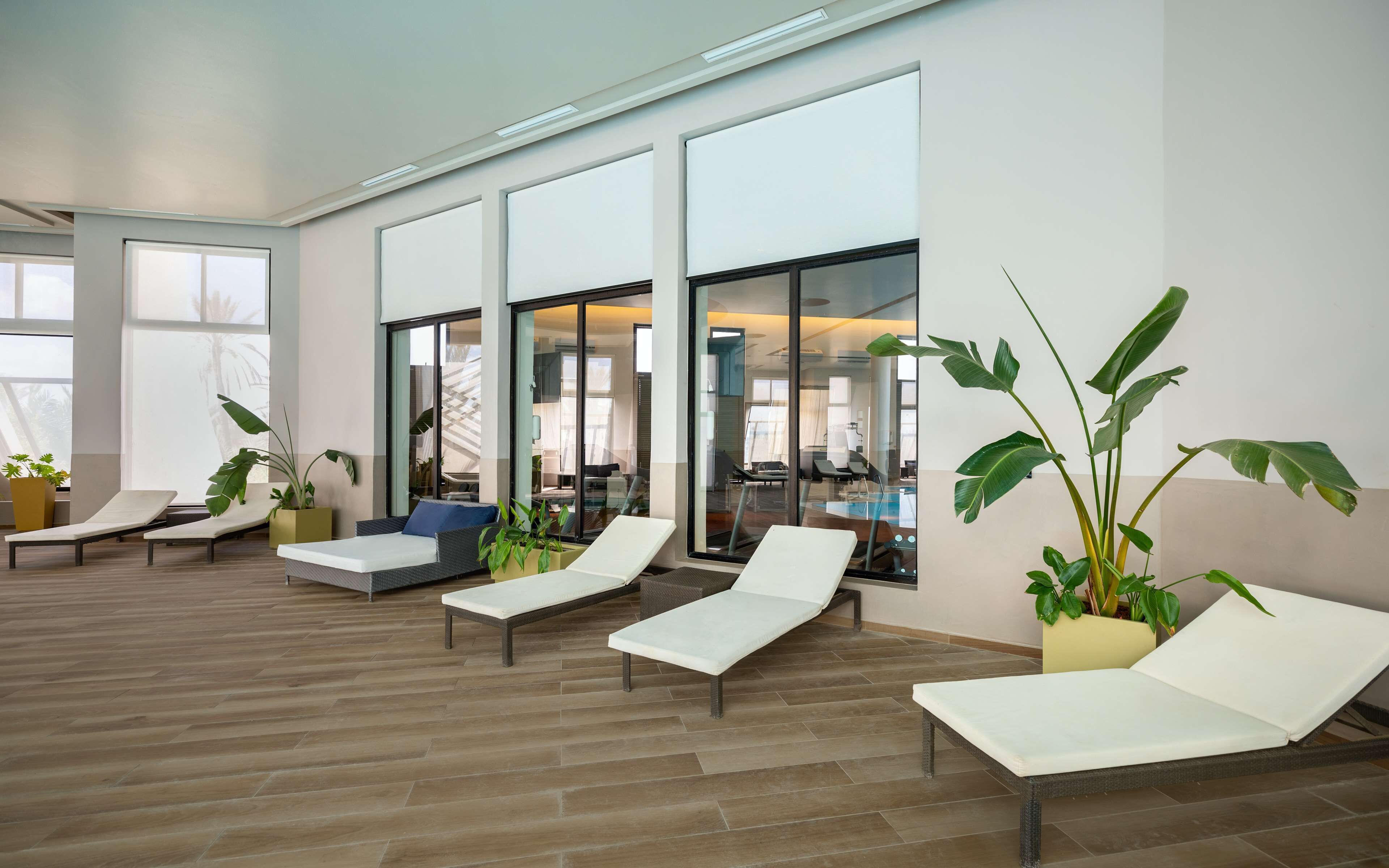 indoor pool, outdoor pool, open 8:00 am to 7:00 pm, pool umbrellas