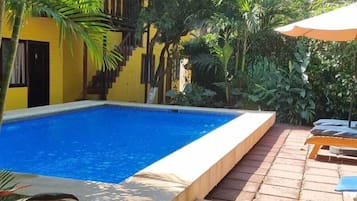 Outdoor pool, open 8:00 AM to 9:00 PM, free cabanas