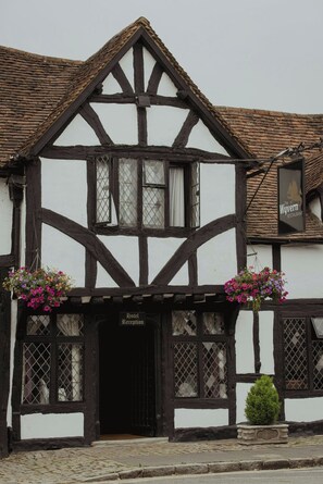A traditional half-timbered building with a sign for 'Weyern Restaurant' above the entrance.