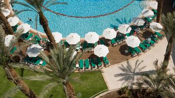 Indoor pool, outdoor pool, pool umbrellas, pool loungers