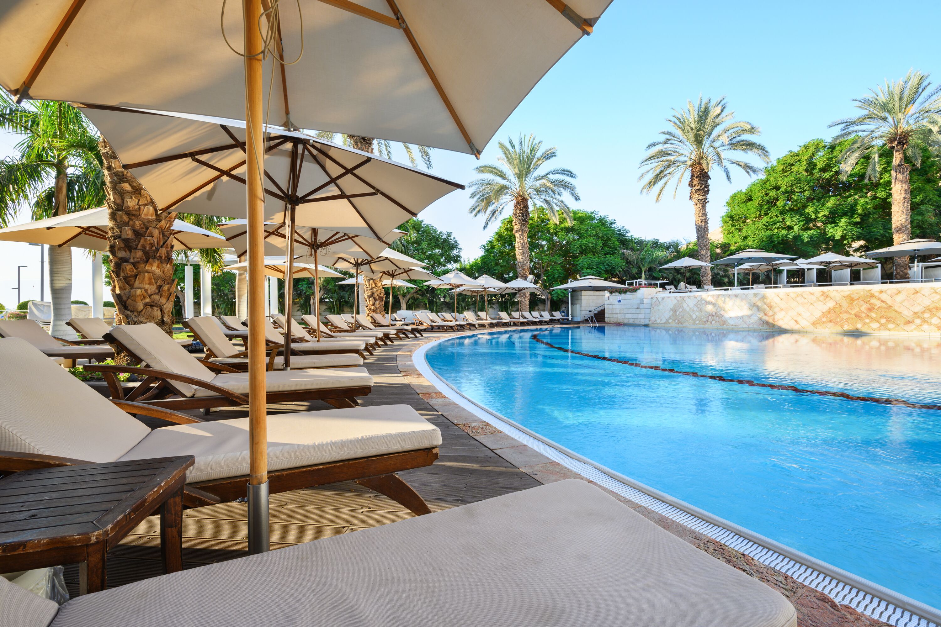 Indoor pool, outdoor pool, pool umbrellas, pool loungers