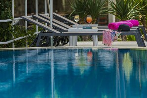 Outdoor pool, pool umbrellas, sun loungers