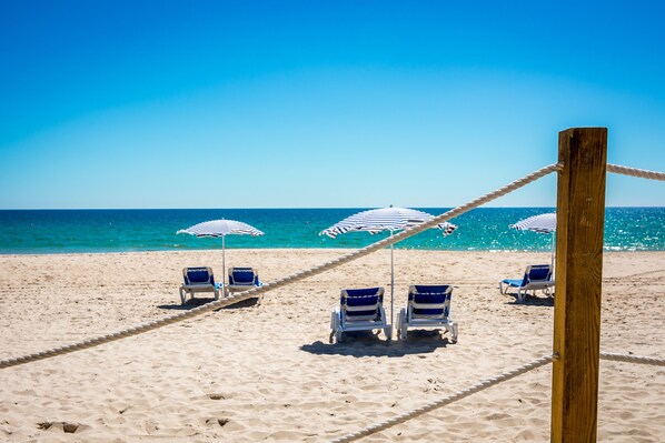 Beach nearby, white sand, free beach shuttle, sun loungers