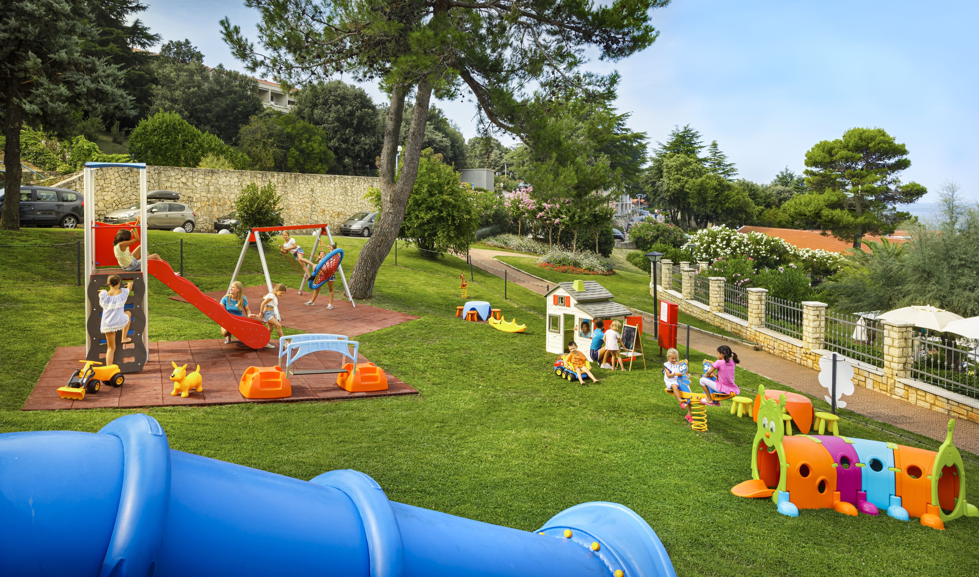 A playground with slides, swings, and climbing structures.