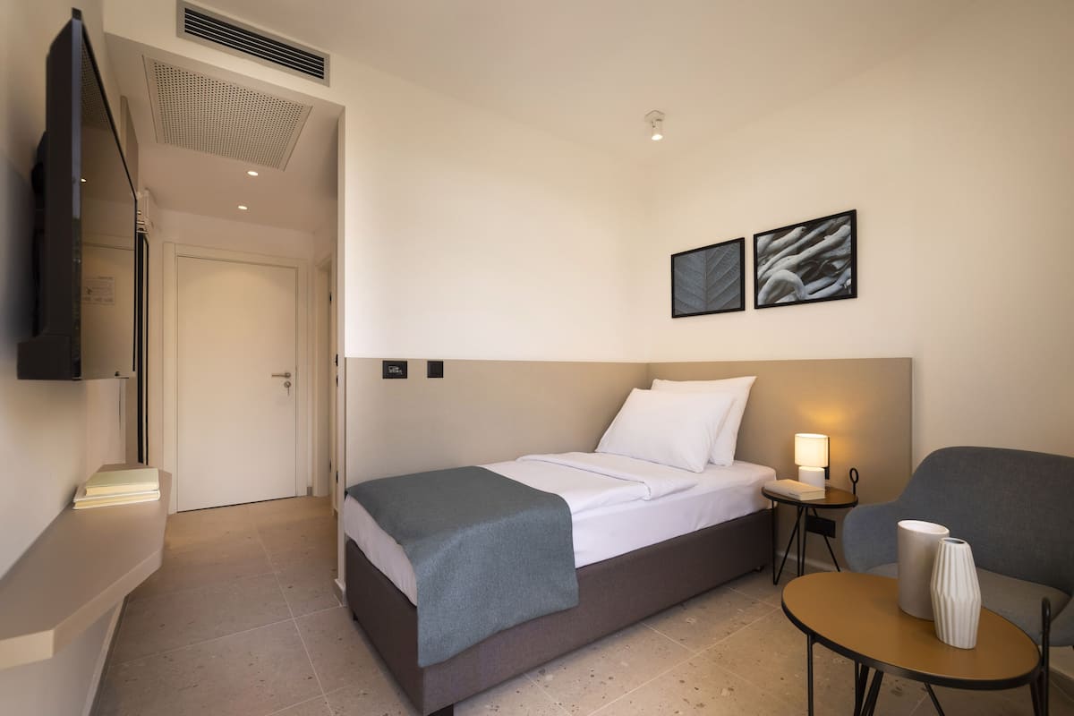 Basic Single Room, Balcony, Sea Facing | In-room safe, blackout drapes, bed sheets