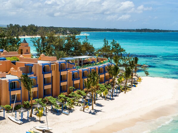 A resort with multiple buildings, a beach, and clear blue waters. - SALT of Palmar, an adult-only boutique Hotel (Belle Mare)