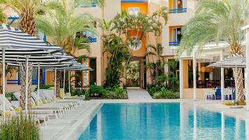 Outdoor pool, open 7:00 AM to 7:00 PM, pool umbrellas, pool loungers