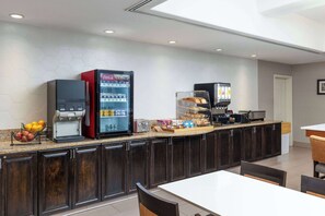 A modern kitchen area with a coffee machine, a refrigerator, and a microwave. - La Quinta Inn & Suites by Wyndham Bakersfield North (Bakersfield)