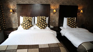 Deluxe Quadruple Room | Hypo-allergenic bedding, in-room safe, desk, WiFi