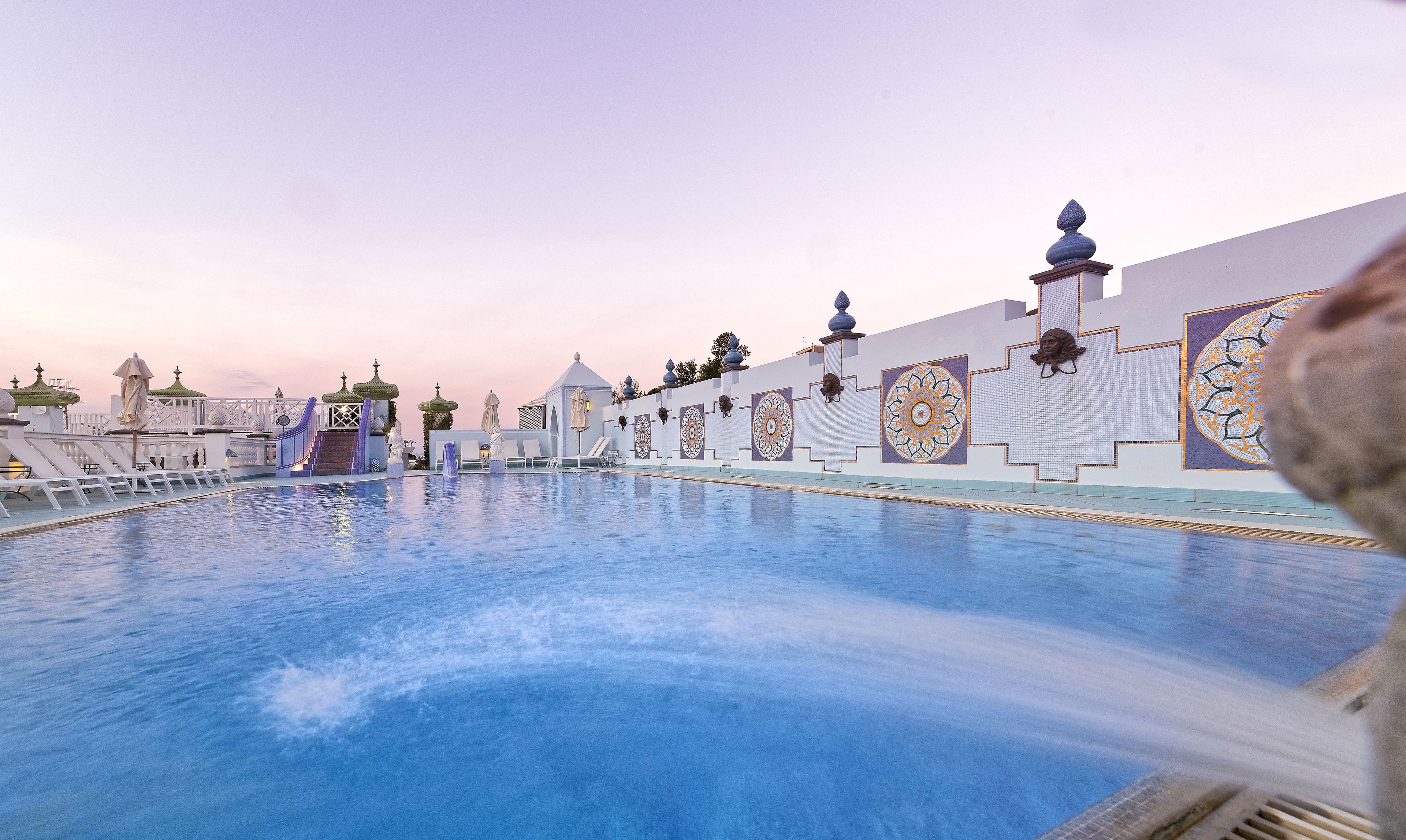 indoor pool, outdoor pool, pool umbrellas