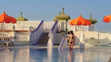 Indoor pool, outdoor pool, pool umbrellas