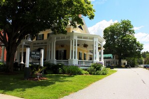 A large, yellow building with a white porch and columns, labeled as "The Inn at Montpelier." - The Inn at Montpelier (Montpelier)