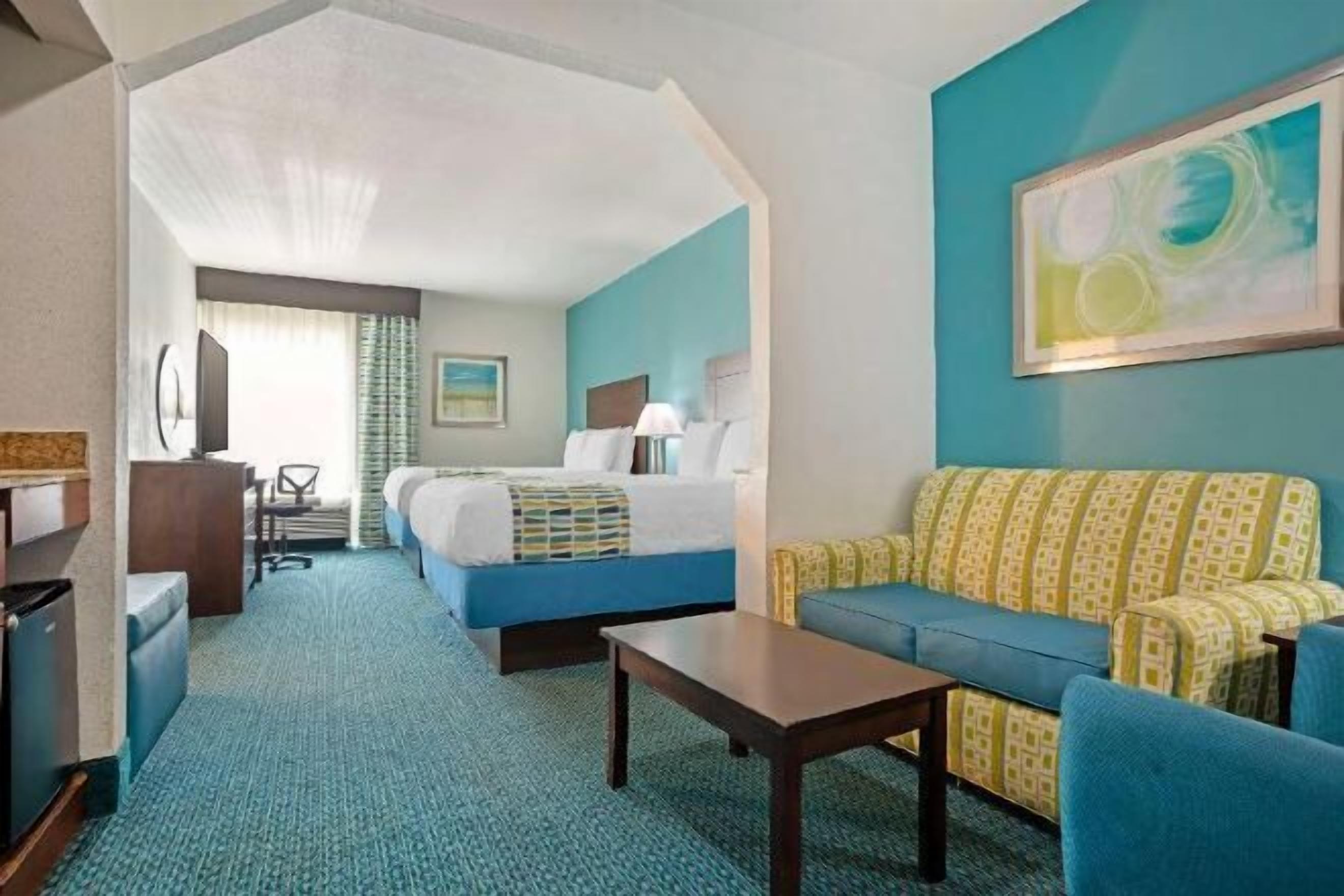 Desk, laptop workspace, blackout drapes, iron/ironing board