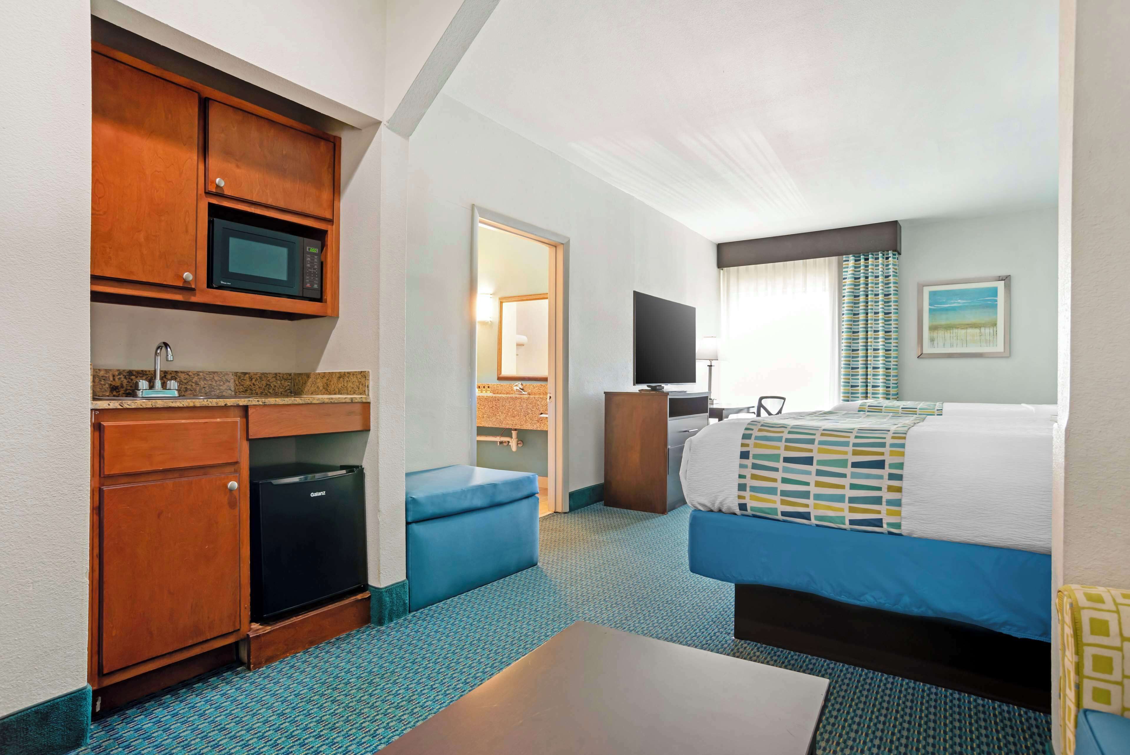 suite, 2 queen beds, non smoking, refrigerator & microwave | desk, laptop workspace, blackout curtains, iron/ironing board