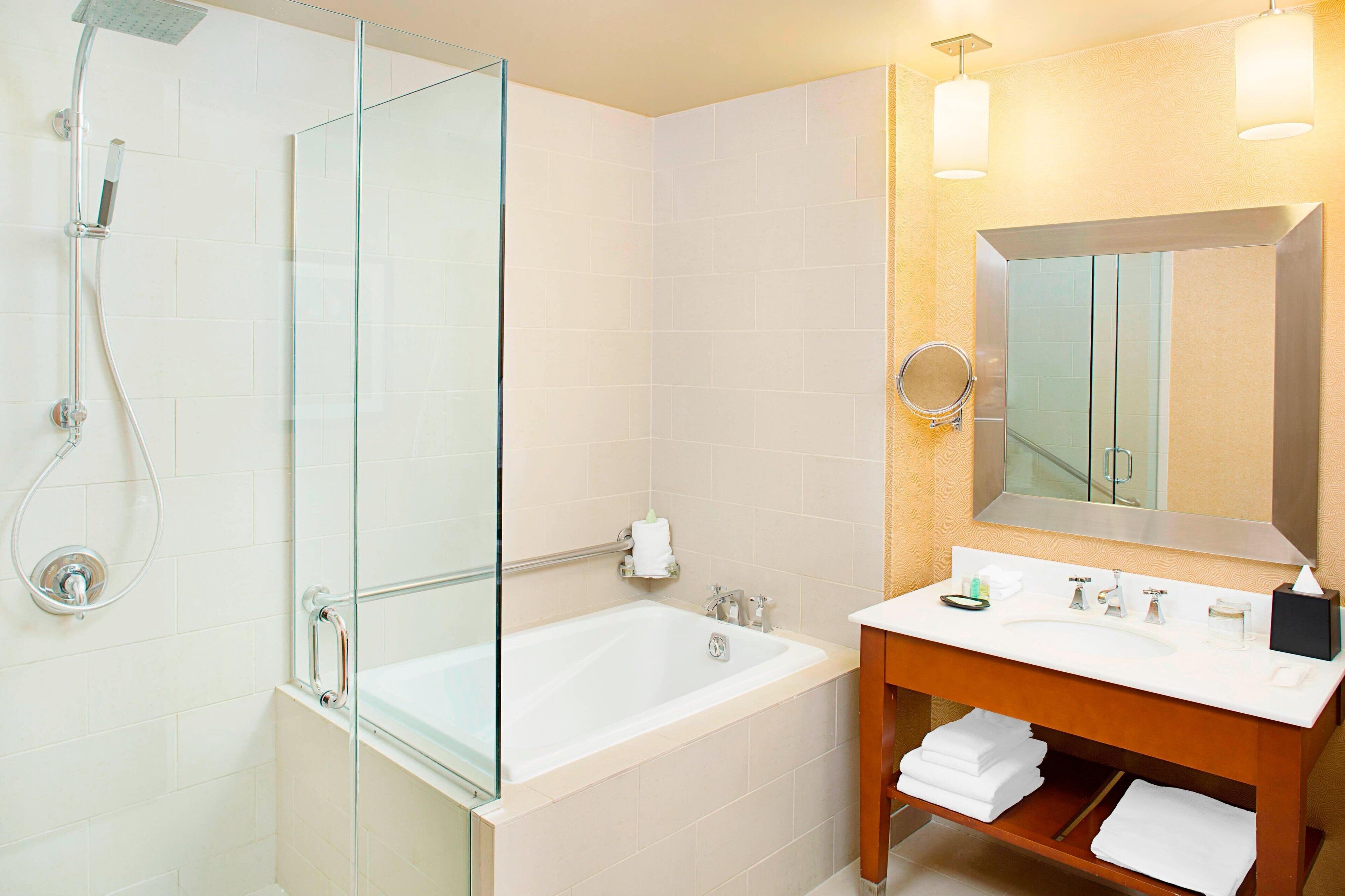 combined shower/bathtub, designer toiletries, hair dryer, bathrobes