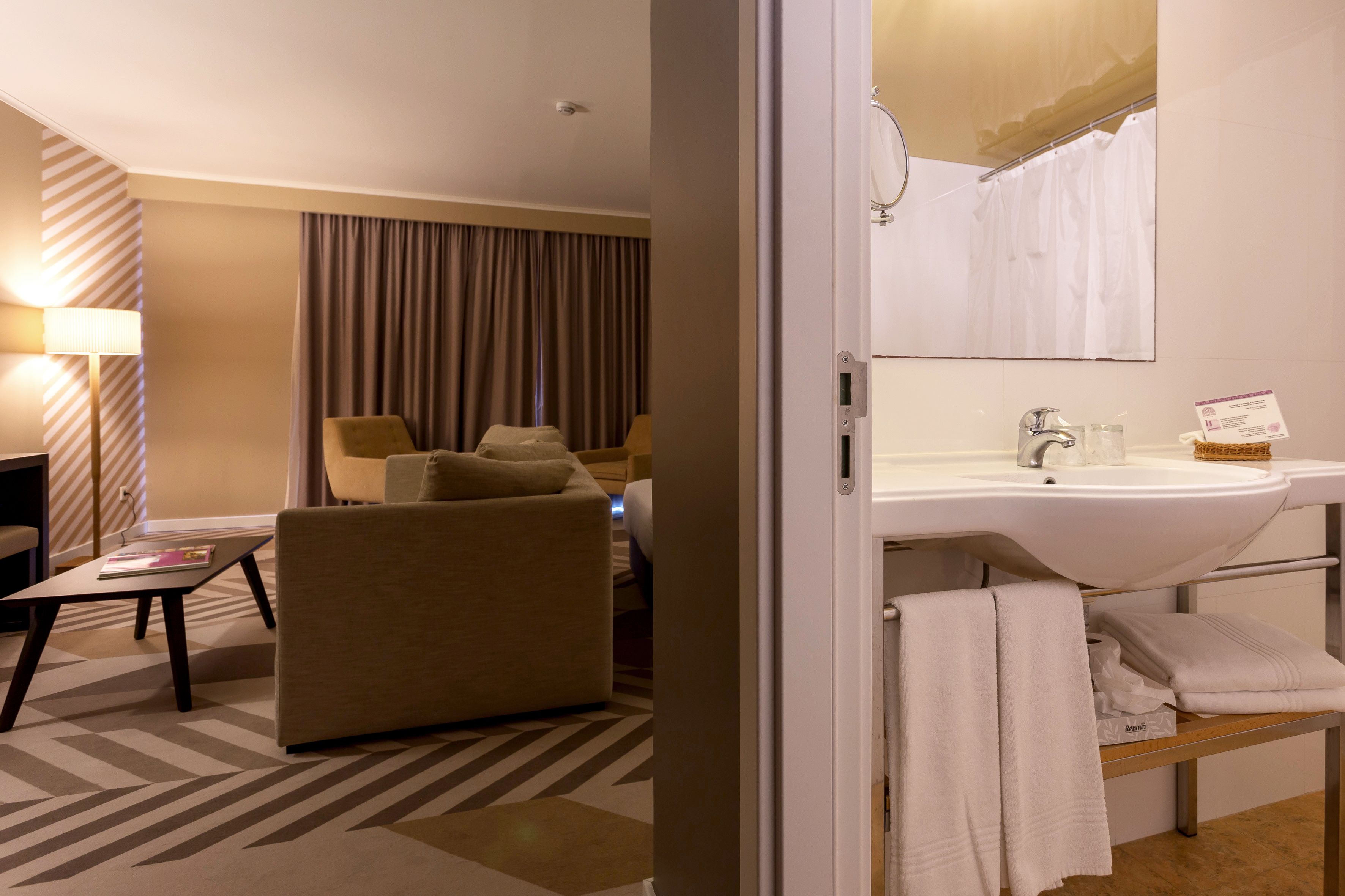 designer toiletries, hair dryer, bidet, towels