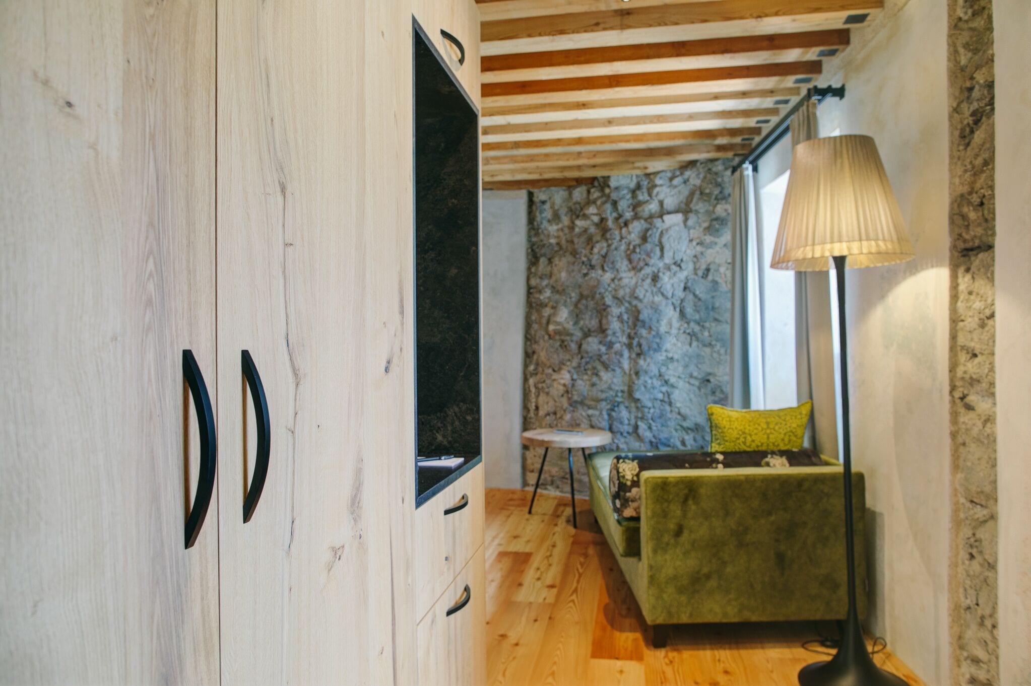 deluxe double room | living area | flat-screen tv, first-run films, heated floors