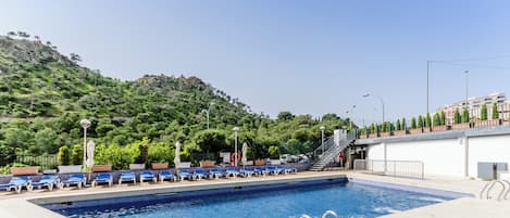 Seasonal outdoor pool, pool umbrellas, pool loungers