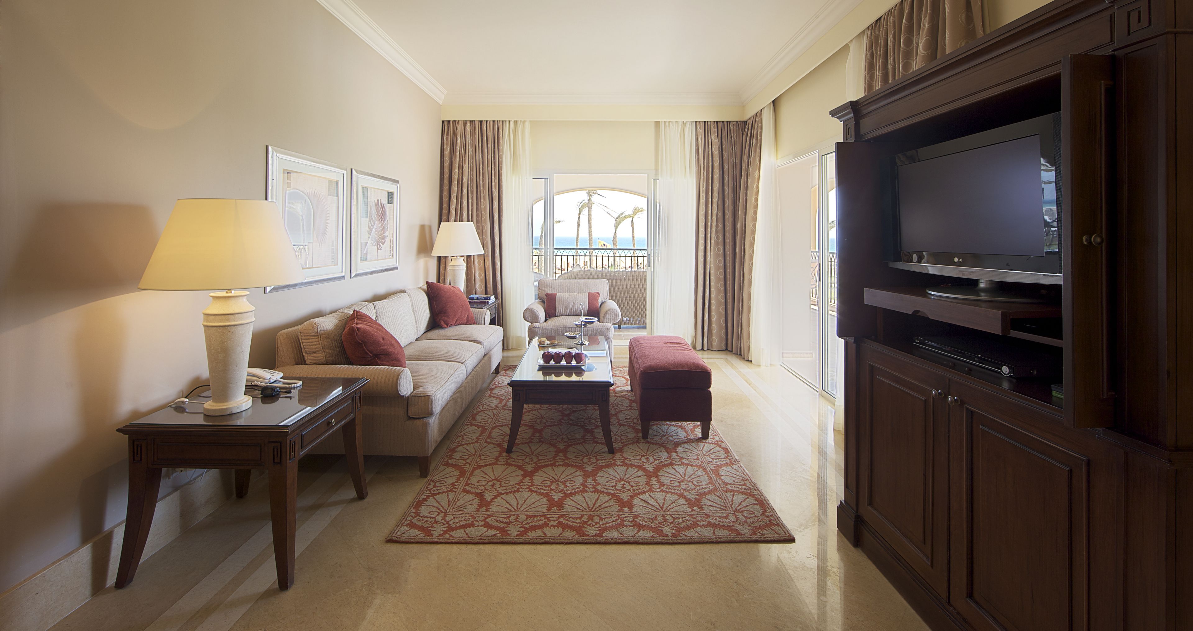 executive suite, 1 queen bed, sea view | living area | 43-inch lcd tv with cable channels, tv