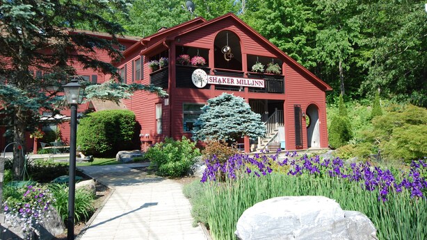 A red building with a sign reading "Shaker Mill Inn." - Shaker Mill Inn (West Stockbridge)