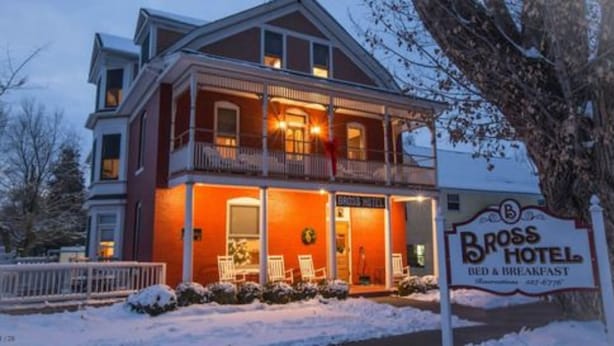 A two-story building with a sign for the Bross Hotel, indicating it offers bed and breakfast services. - Bross Hotel (Paonia)