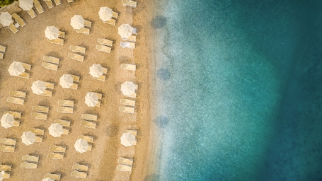 Beach nearby, sun-loungers, beach umbrellas, motor boating