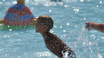 Seasonal outdoor pool, pool umbrellas
