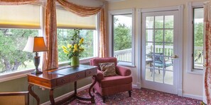 Sunset Suite, 1 King Bed, Balcony | Living area | Flat-screen TV, DVD player, iPod dock