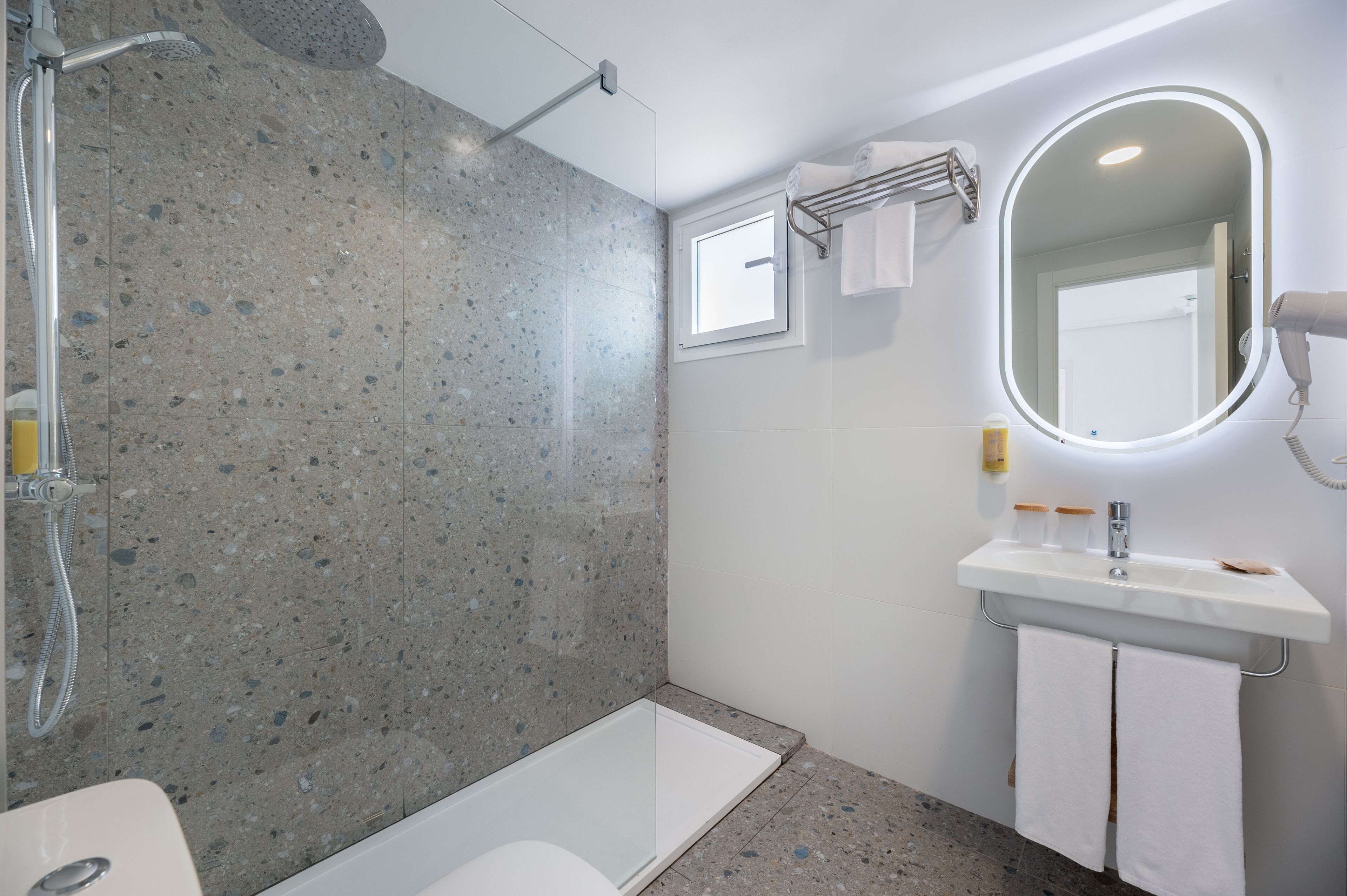 superior double room | bathroom | shower, hair dryer, towels