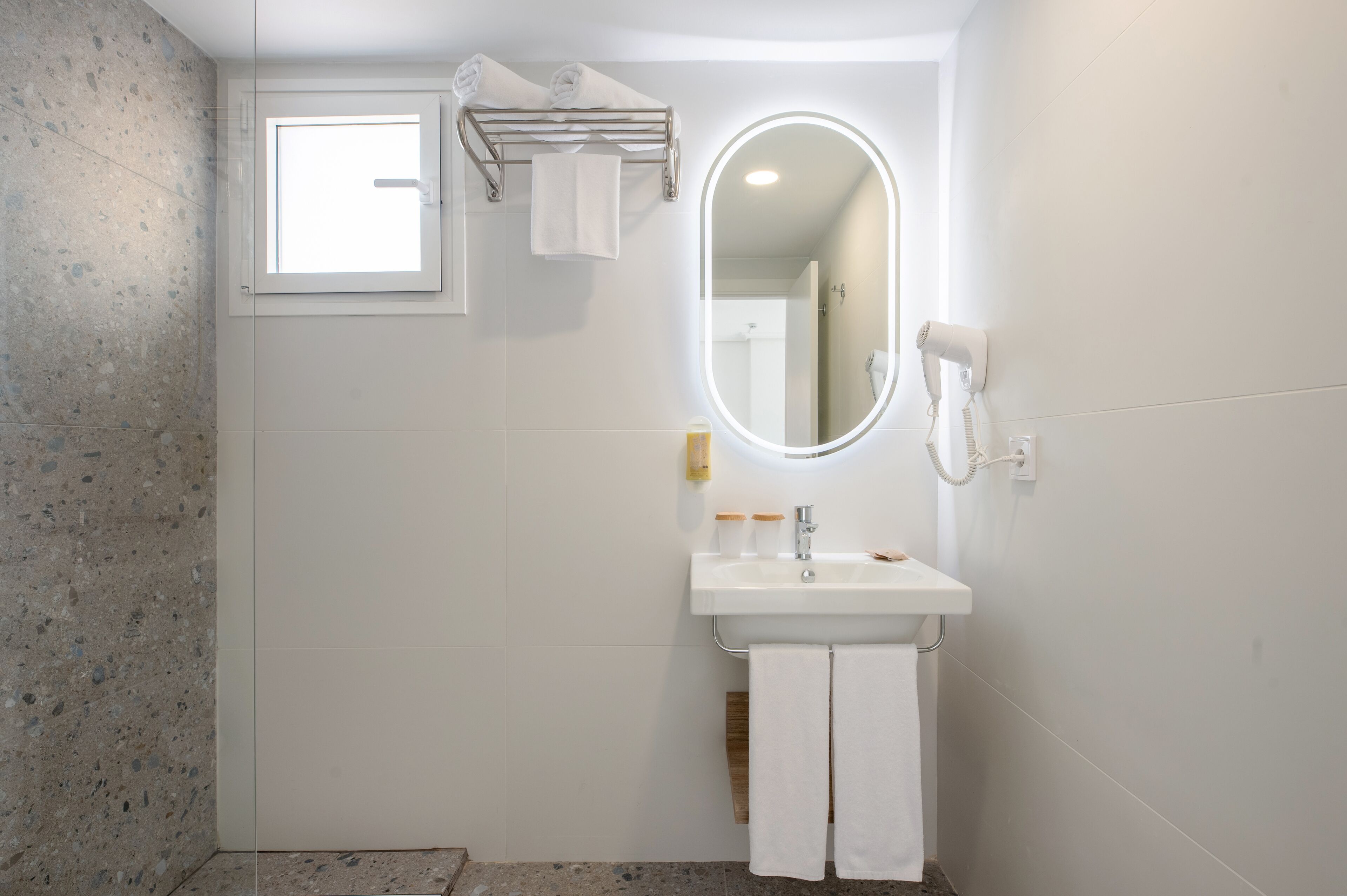 superior double room | bathroom | shower, hair dryer, towels