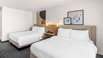 Down duvets, pillow-top beds, in-room safe, desk