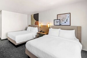 Down comforters, pillowtop beds, in-room safe, desk