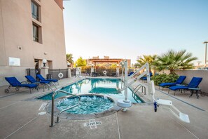 A pool area with blue lounge chairs, a hot tub, and a 'No Diving' sign. - Hilton Garden Inn El Paso / University (El Paso)