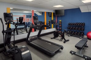 A gym with treadmills, exercise bikes, and a variety of weights. - Hampton Inn & Suites North Conway (North Conway)