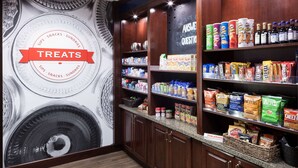 A snack and treat section with a variety of packaged goods, including chips, cookies, and chocolates.