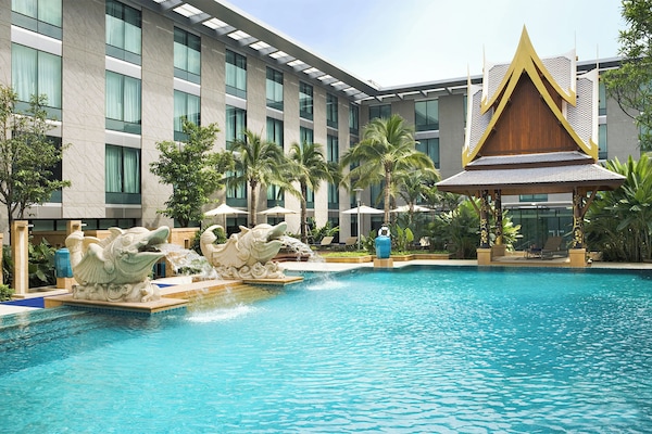 Outdoor pool, open 6:00 AM to 10:00 PM, pool umbrellas, pool loungers