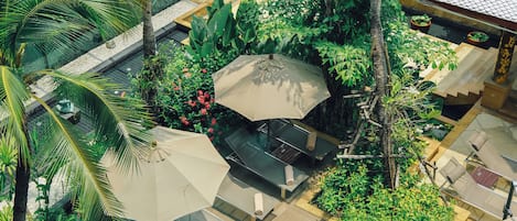 Outdoor pool, open 6:00 AM to 10:00 PM, pool umbrellas, sun loungers