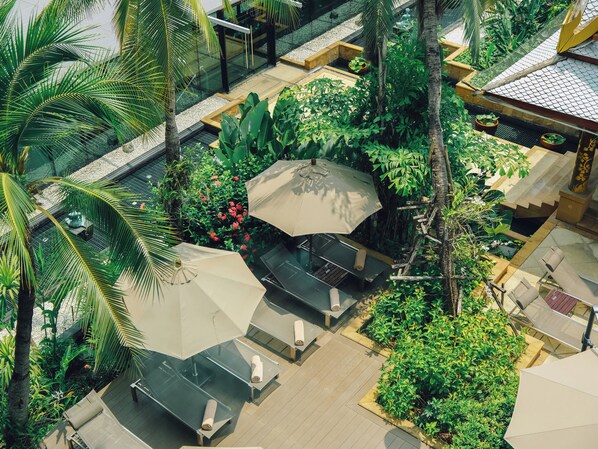 Outdoor pool, open 6:00 AM to 10:00 PM, pool umbrellas, pool loungers