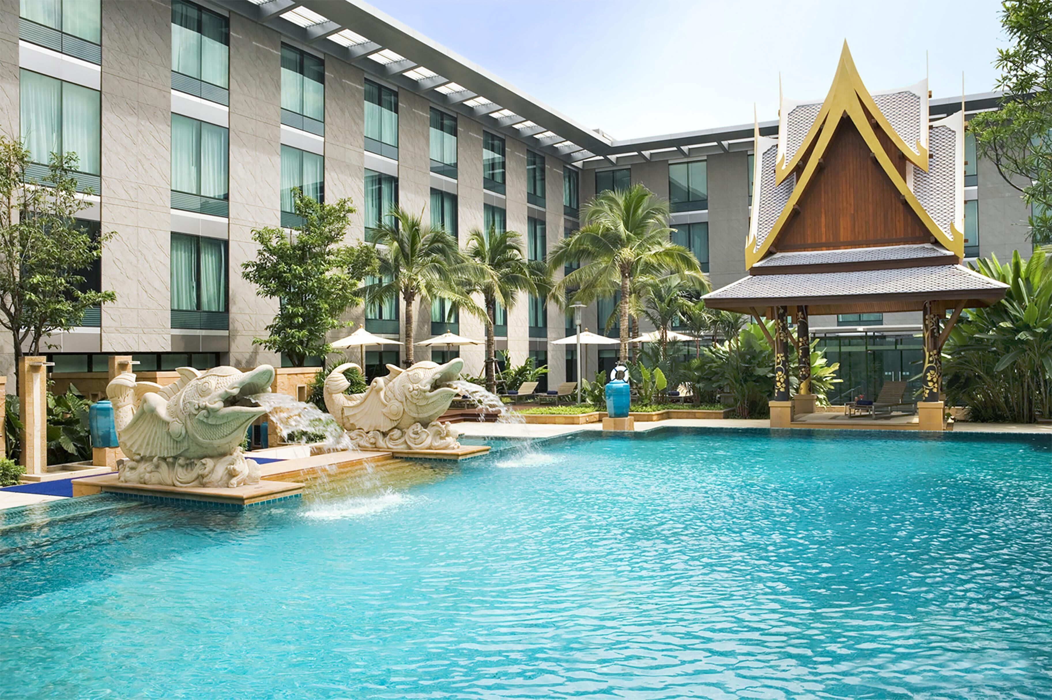 Outdoor pool, open 6:00 AM to 10:00 PM, pool umbrellas, pool loungers